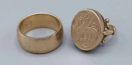 A 9ct gold locket ring with engraved decoration, together with a 9ct gold band ring, 14.4gms