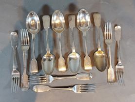 A set of six Victorian silver table spoons by George Adams, together with three matching forks,
