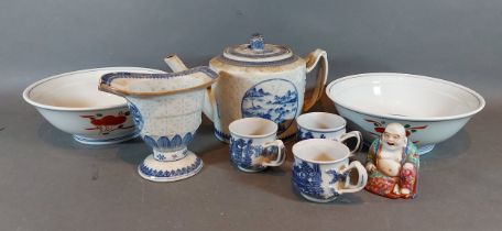 A Chinese underglaze blue decorated teapot together with a pair of Chinese porcelain bowls, a