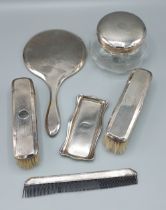 A Birmingham silver four piece dressing table set together with a London silver pin tray with