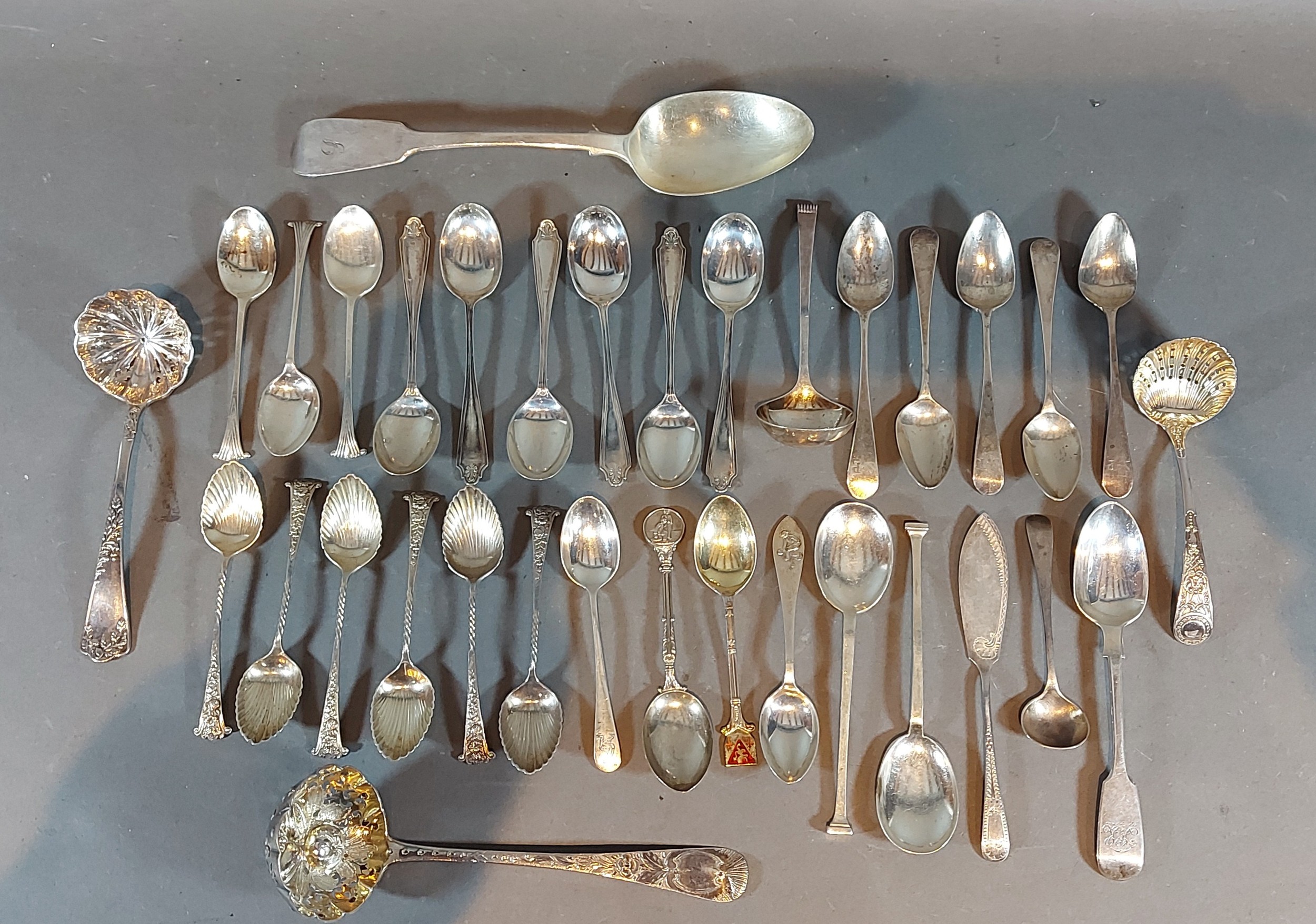 A set of six Birmingham silver teaspoons together with a collection of silver flatware to include