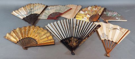 A late 19th early 20th Century silk and lacquered fan, the silk decorated with birds and with gilt