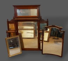 A Victorian sectional over mantel mirror with an arrangement of shelves, together with two other