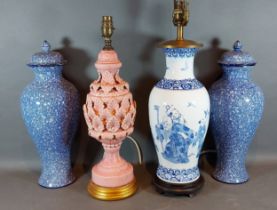 A Chinese style porcelain lamp together with another lamp and a pair of large covered vases