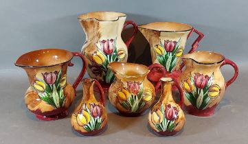 A collection of Seven Tunstall Tuliptime pattern jugs