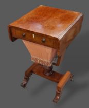 A Victorian mahogany work table, the drop flap top above a frieze drawer opposed by dummy drawer