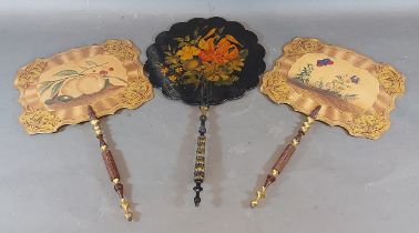 A 19th Century lacquered face screen decorated with flowers and with turned handle, together with