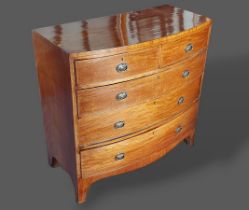 A 19th Century mahogany bow fronted chest of two short and three long drawers with circular brass