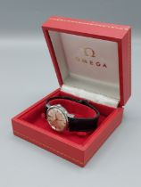 An Omega Seamaster stainless steel cased gentlemans wristwatch with leather strap, complete with