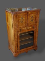 A Victorian walnut marquetry inlaid music cabinet, the low brass gallery above two doors, a drawer