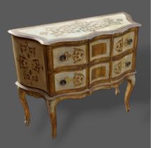 A French painted small commode with two drawers raised upon cabriole legs with scroll feet, 100cms