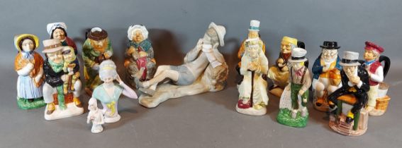 A Lladro porcelain figure of a boy together with a collection of character jugs and two pin dolls