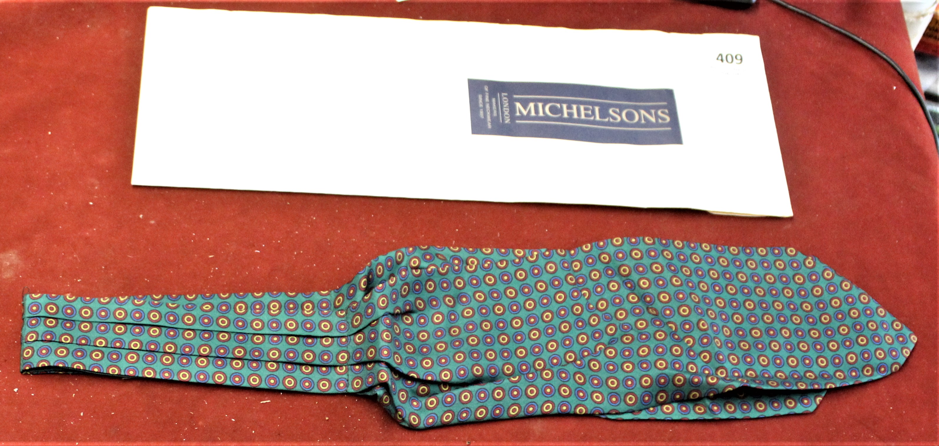 Silk Cravat-Made in England by Michelson's of London patterned (Ringed) on green back ground-
