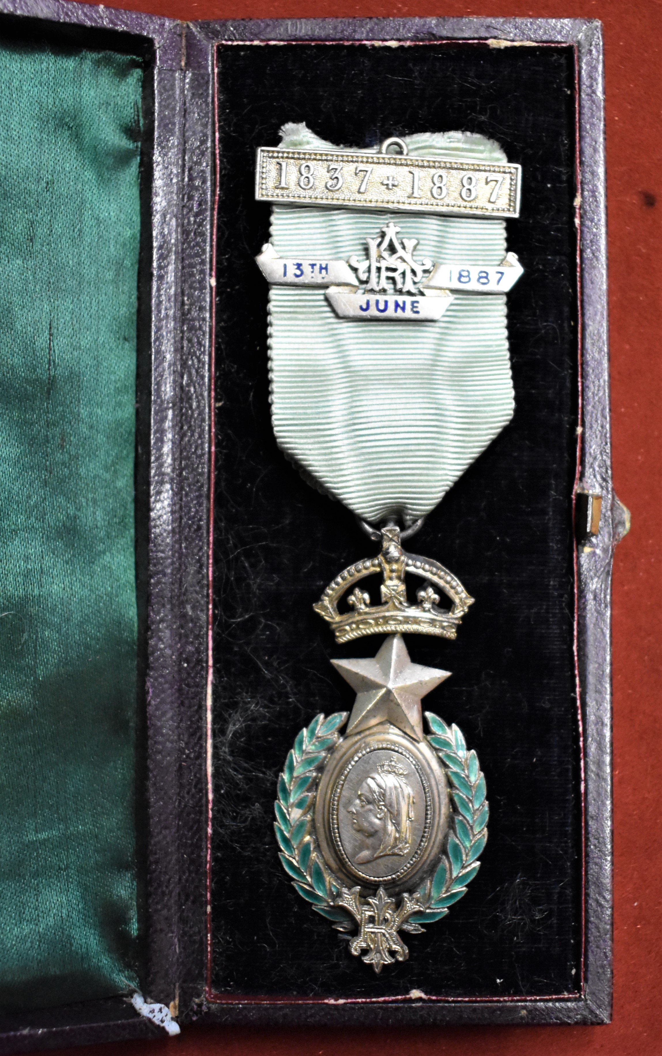 Masonic Queen Victoria's Jubilee Jewel 1837-1897 in silver and enamel, the ribbon having two