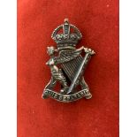 British WWII Royal Irish Rifles cap badge, white-metal and slider.