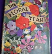 The Floral Year, hardcover book with dustcover, dustcover has wear & tear to all corner and edges,