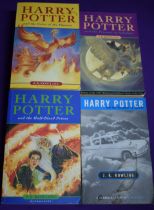 A collection of 4 Softcover Harry Potter Books - Harry Potter And The Prisoner Of Azkaban,