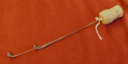 A pair of silver plate golf club hat pins dated 1910-1920's