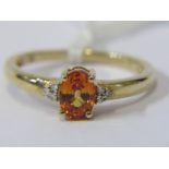 9ct YELLOW GOLD ORANGE TOPAZ & DIAMOND RING, principal oval cut orange topaz with accent diamonds to
