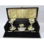 BOXED SILVER WRITING SET, comprising circular ink well, pair of weighted dwarf candlesticks, (1 a/f)