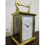 CARRIAGE CLOCK, brass cased bevel glass carriage clock by William Widdob with key, 12cm height