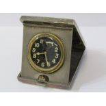 ART DECO SILVER TRAVELLING CLOCK, the black dial 8 day clock by Goldsmith & Silversmith Co, in a