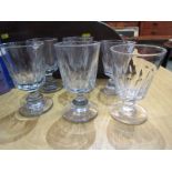 ANTIQUE GLASSWARE, set of four heavy glass rummers with facet cut bodies, knop stems & heavy