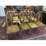 WHEELBACK CHAIRS, a carver wheelback chair and 3 matching singles
