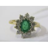 18ct YELLOW GOLD EMERALD & DIAMOND CLUSTER RING, principal oval cut emerald, surrounded by well