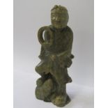 ORIENTAL CARVING, an Eastern carved hardstone figure of Deity with large toad, 23cm height