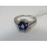 TANZANITE & DIAMOND RING, 18ct white gold ring set a large oval tanzanite with 8mm spread, with