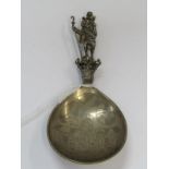 CONTINENTAL SILVER SPOON, the finial in the form of a shepherd carrying a child, the bowl engraved