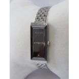 GUCCI, Lady's dress watch rectangular form stainless steel case, double boxed with papers