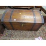 ANTIQUE DOMED TRUNK, metal banded with side carrying handles and tapering body, 85cm width