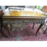 GEORGIAN DESIGN CARVED WALNUT CONSOLE TABLE, with carved foliate and pierced frieze with claw