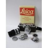 VINTAGE PHOTOGRAPHY, Leica camera stamped 241078 with additional lenses and manual