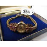 LADY'S GOLD CASED COCKTAIL WATCH, French 18ct gold cased wrist watch on strap (French HM) set rubies