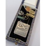 SELECTION OF LAPEL PINS, including ECC 9ct gold Long Service pin, Hanomag pin, Volvo pin, Mercedes
