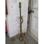 BRASSWARE, Edwardian brass trefoil base candle stand, 112cm height