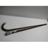WALKING STICKS, Eastern silver capped walking stick together with carved ribbed body walking cane