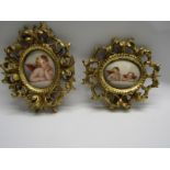 2 GILTWOOD OVAL FRAMES, containing oval putti portraits, 18cm diameter