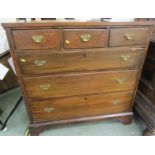 ANTIQUE OAK STRAIGHT FRONT CHEST, 3 short and 3 long graduated drawers with shaped brass Georgian