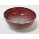 RUSKIN, a mottled red glazed flambe 10cm diameter stemmed bowl