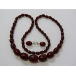 CHERRY AMBER STYLE NECKLACE, graduated bead necklace, 29", together with a pair of earrings