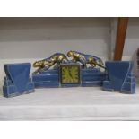 ART DECO, Continental blue and gilded glaze 3 piece clock garniture with wild cat cresting, 42cm