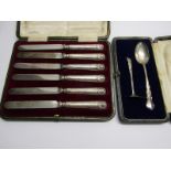 CASED SILVER CHRISTENING SET of spoon and pusher, London 1920; together with cased of set of