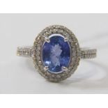 14ct WHITE GOLD TANZANITE & DIAMOND RING, principal oval cut tanzanite in excess of 2 carats