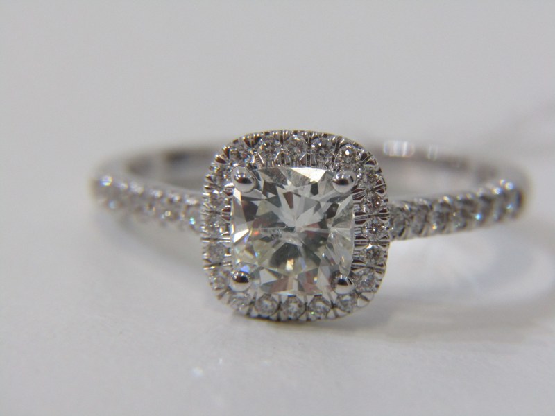 18ct WHITE GOLD DIAMOND SOLITAIRE RING, principal fancy cushion cut diamond set in diamond halo