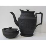 GEORGIAN BASALT COFFEE POT with relief decoration, together with Wedgwood basalt oval fluted base