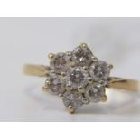 18CT YELLOW GOLD DIAMOND CLUSTER RING, in the form of a daisy, bright well matched brilliant cut